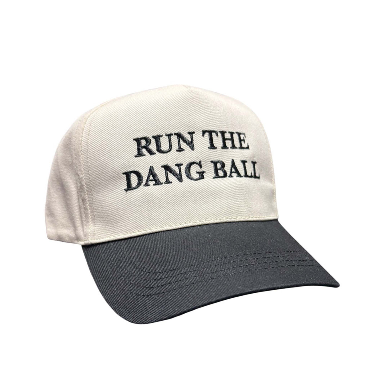 Neutral and black two-tone baseball hat with “Run the Dang Ball” text embroidered on the crown.