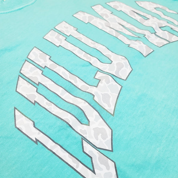 Close up of Chalky mint short sleeve t-shirt with 'LULU MAC' in white camo filled text across the chest.