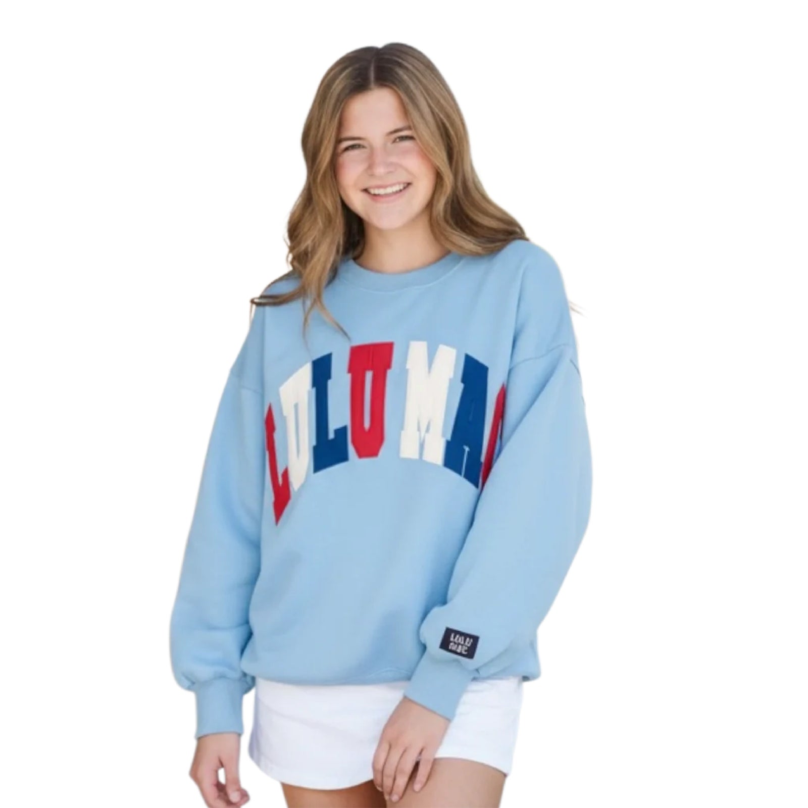 Woman wearing a light blue sweatshirt with colorful text on a white background