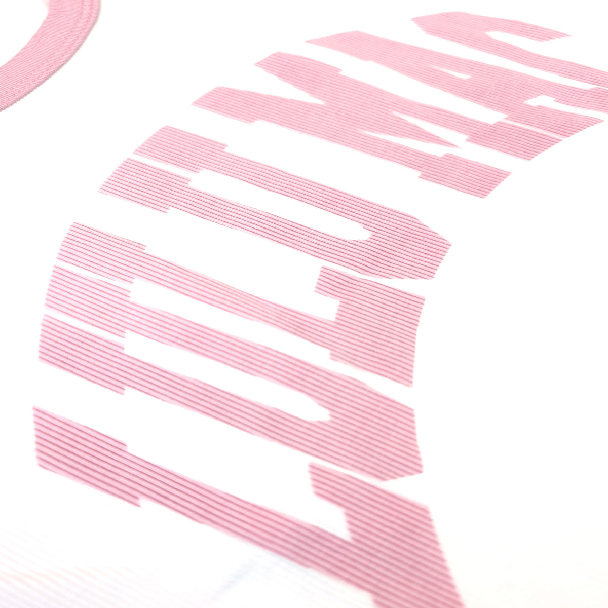 Close up of ribbed LuluMac design on white tank top.