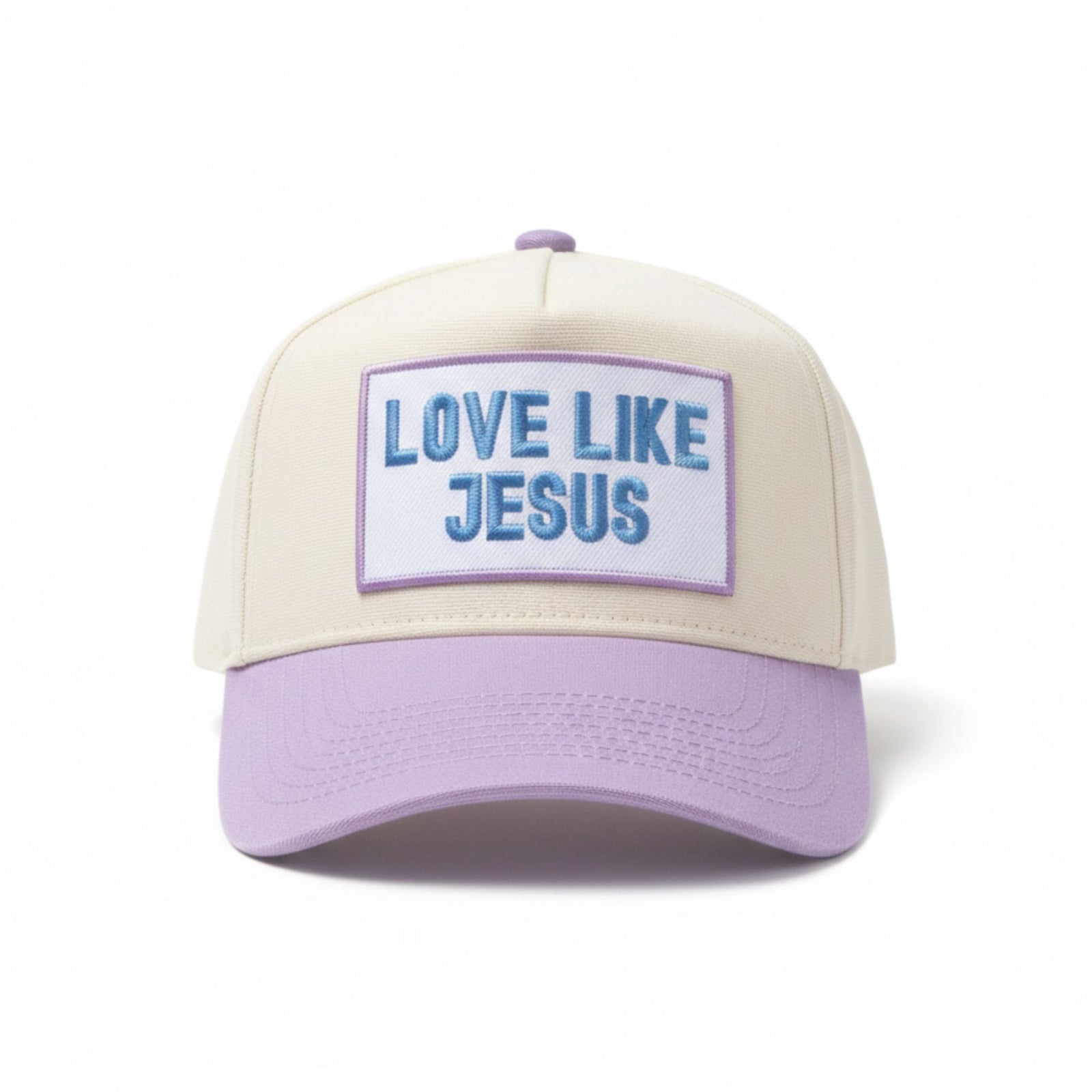 KenzKustomz Love Like Jesus trucker hat with cream crown, periwinkle brim, and embroidered patch reading “Love Like Jesus.”