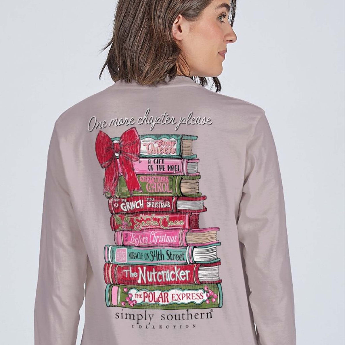 Driftwood grey long sleeve shirt with the phrase 'One more chapter please' and a stack of Christmas themed books.