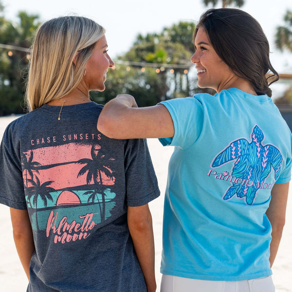  two girls smiling for a photo wearing palmetto moon t-shirts