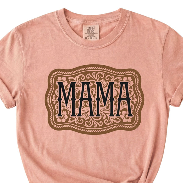 Peach t-shirt with “MAMA” graphic in a western-style buckle design on front.