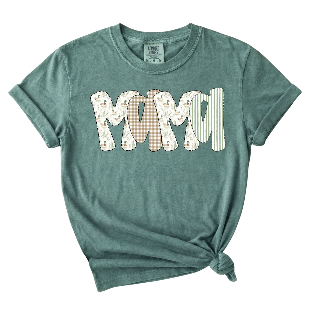 Light green t-shirt with “Mama” text in patchwork-style letters featuring duck and gingham patterns.