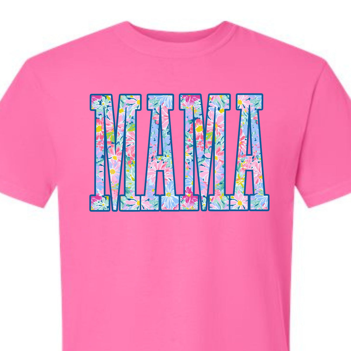 Neon pink t-shirt with large “MAMA” text filled with colorful floral pattern on front.