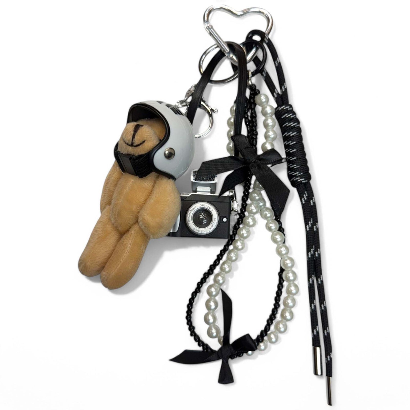 Purse charm shaped like a bear, featuring a rounded body, small ears, and stitched facial details, made of soft faux leather with a metal clip for attaching to bags or keyrings.