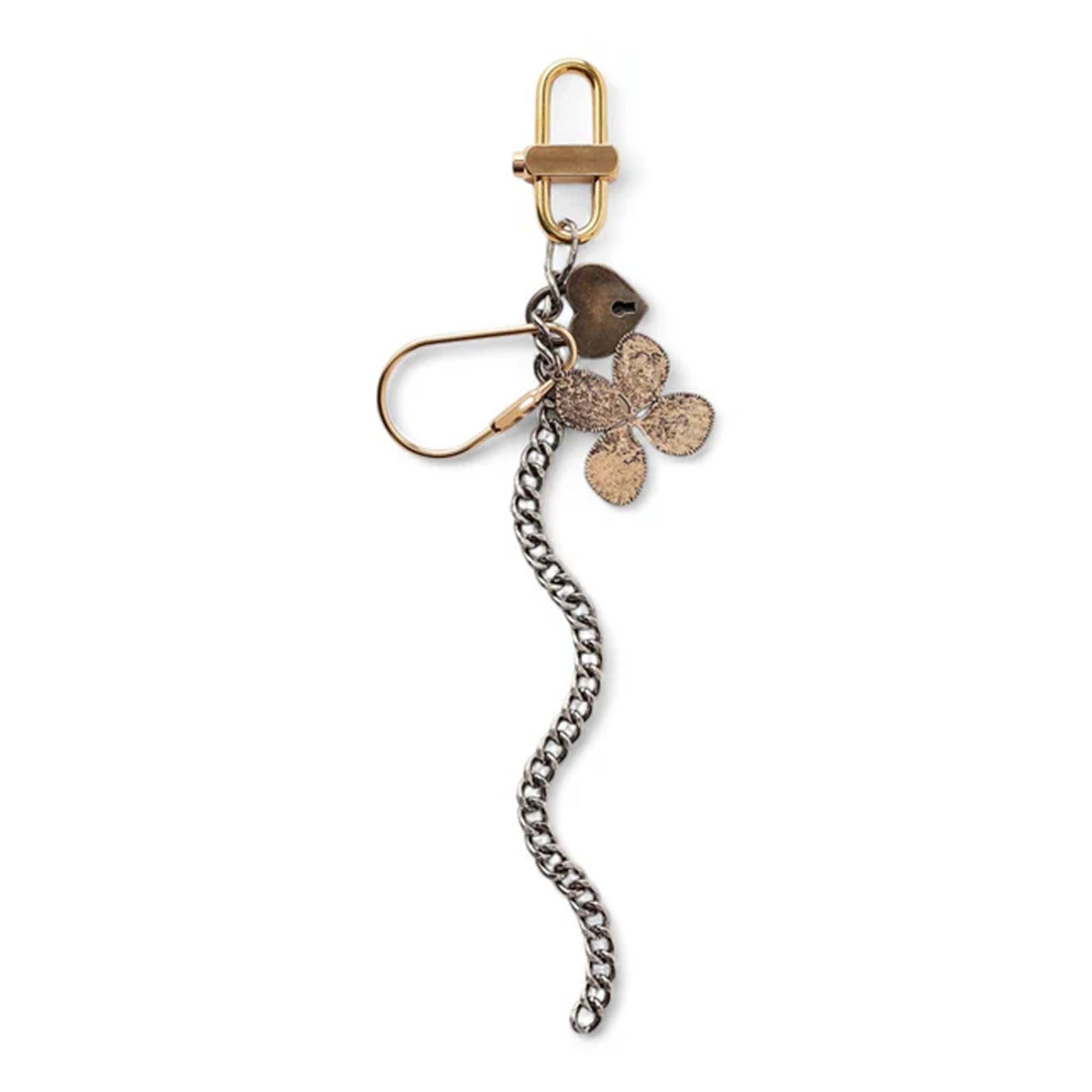 Queen's Designs Flower Chain Bag Charm, mixed metals. Bag charm featuring a silver chain, bronze heart tag, textured four-leaf clover charm, and gold-tone clip, displayed on a white background.