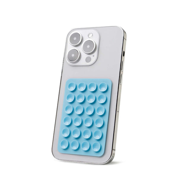 Light blue Tentacle Tech suction phone mount with 24 suction cups secured to the back of a silver smartphone.