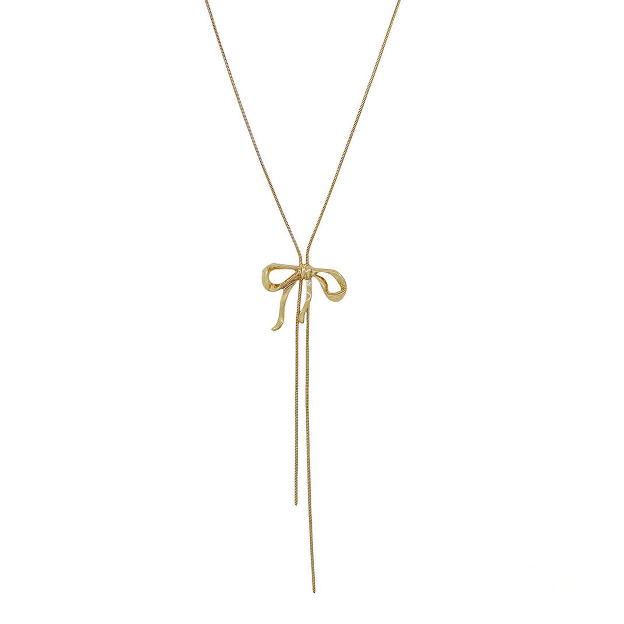 Gold necklace with a bow pendant on a white background