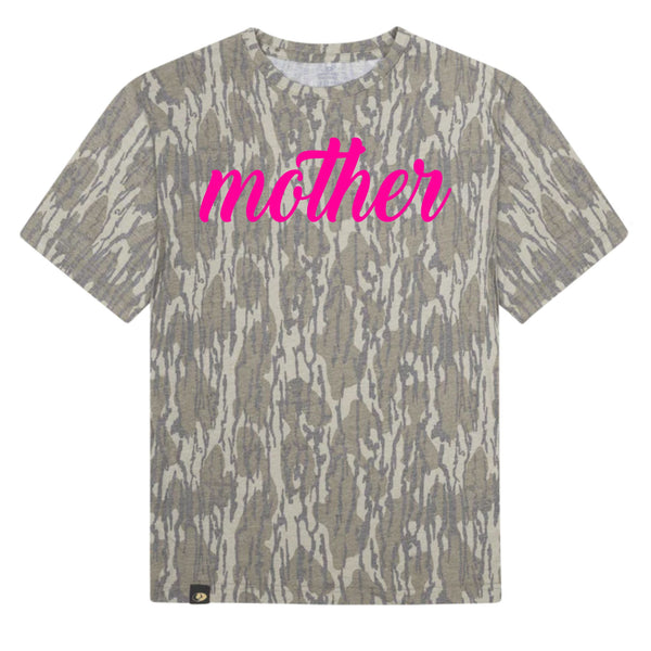 Camo print t-shirt with bright pink “mother” script text across front.