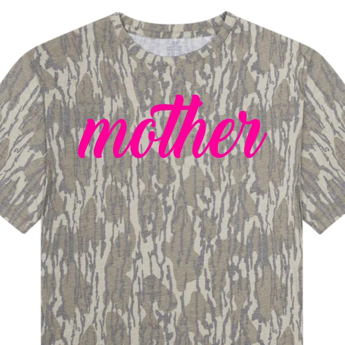 Camo t-shirt with “mother” graphic in pink lettering shown in close-up view.