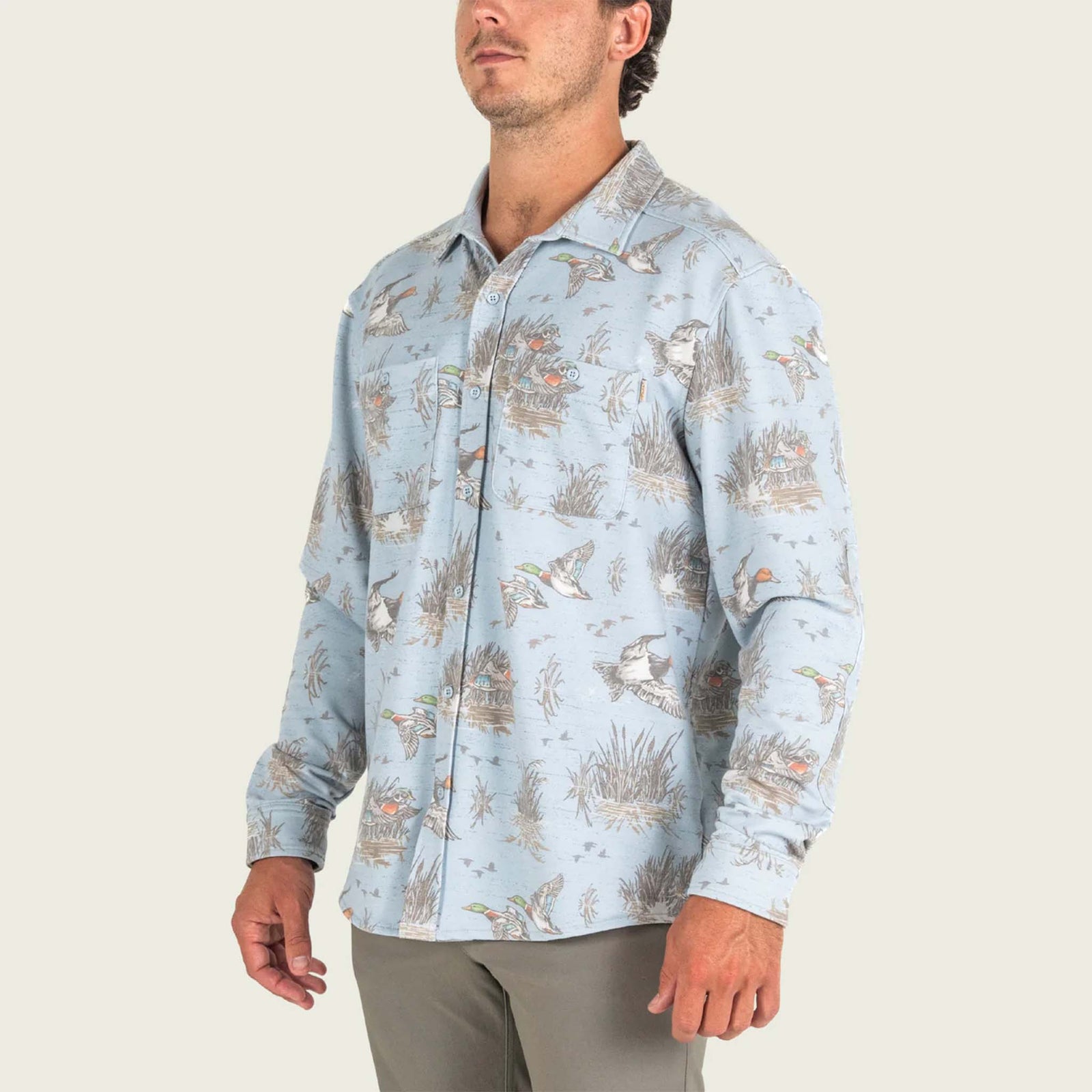 Marsh Wear Men's Fireside Button-Down Overshirt in Smoke blue with all over mallard duck and marsh grass pattern.