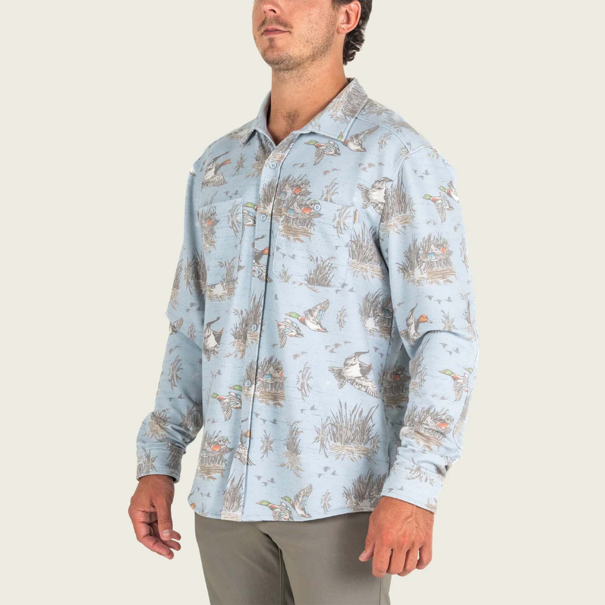Marsh Wear Men's Fireside Button-Down Overshirt in Smoke blue with all over mallard duck and marsh grass pattern.