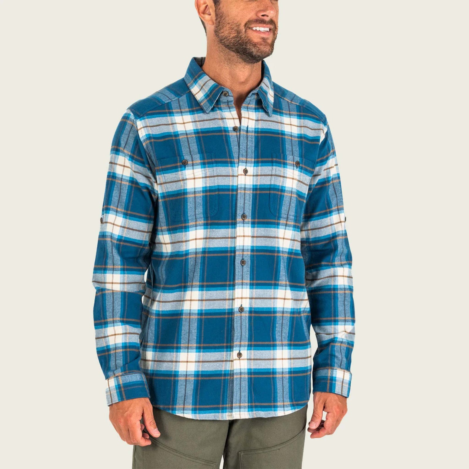 Man wearing a blue plaid shirt on a white background