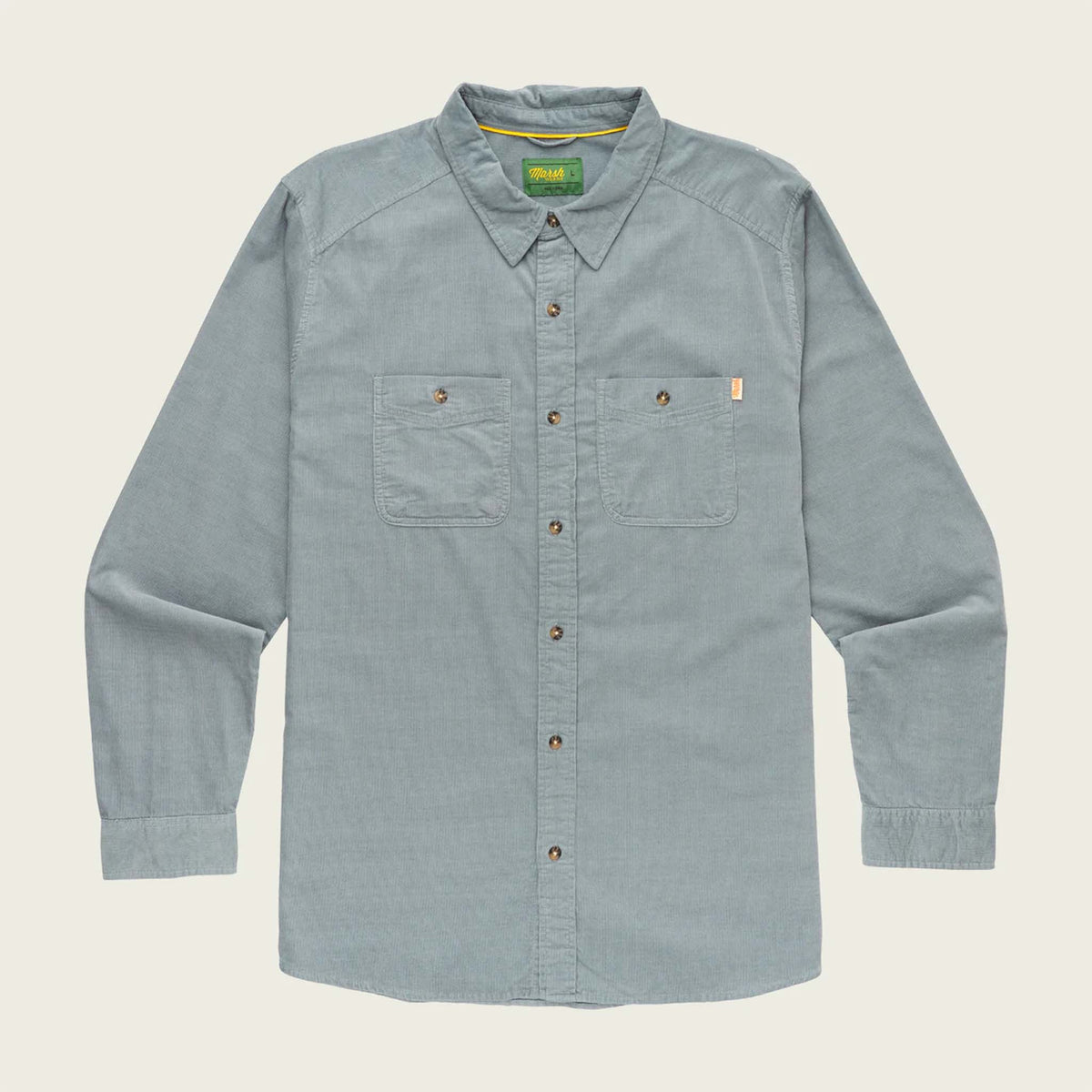 steel grey shirt with button details on a beige background