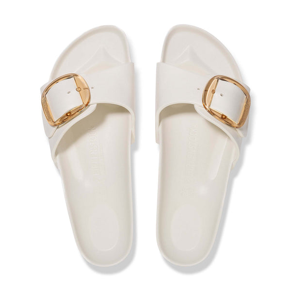 Top view of Birkenstock Madrid Big Buckle sandals in eggshell with oversized gold buckles and molded footbeds.