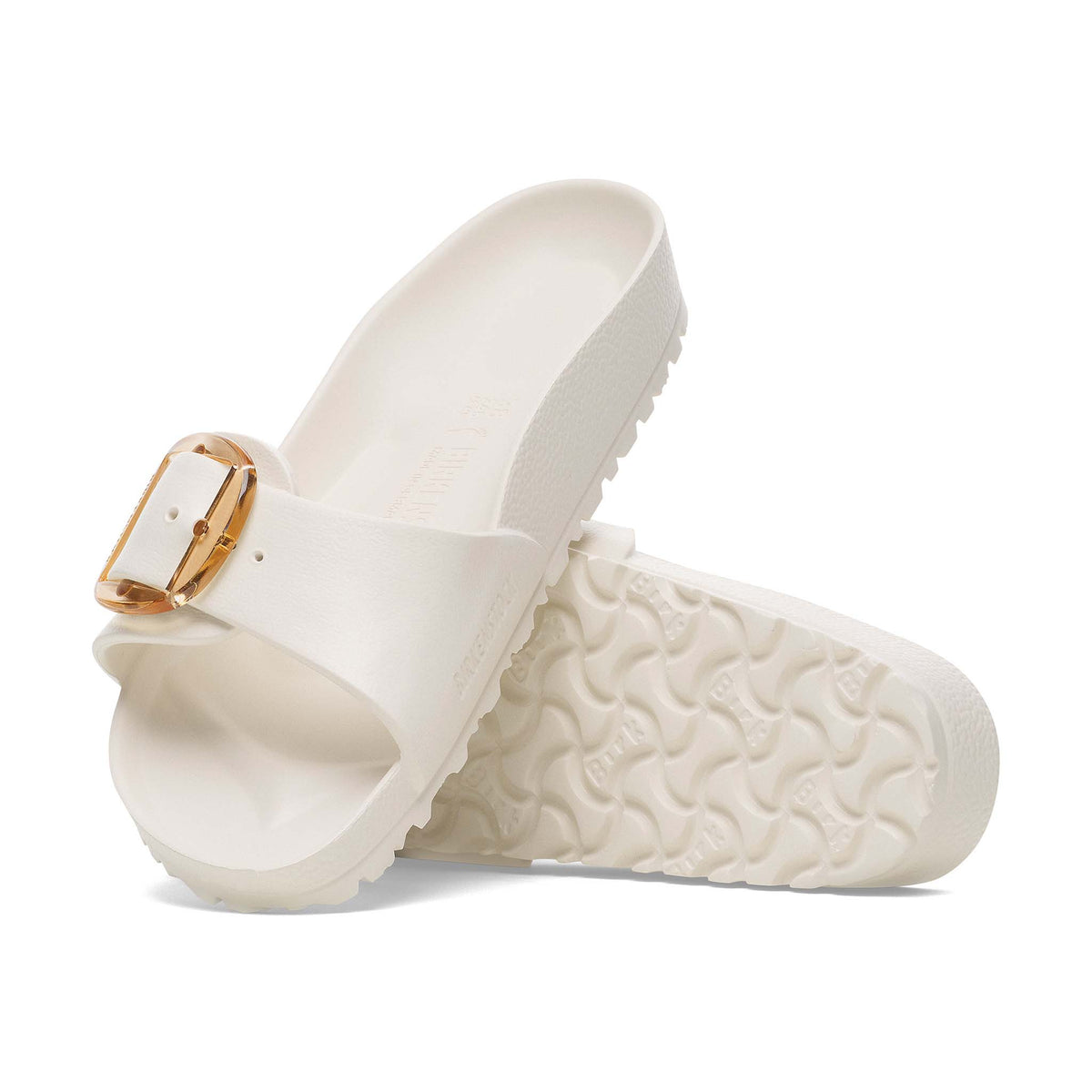 Side view of Birkenstock Madrid Big Buckle sandal in eggshell, featuring contoured footbed and large gold buckle.