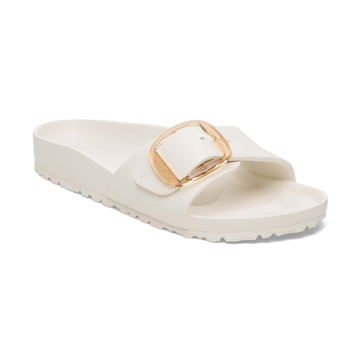 Birkenstock Madrid Big Buckle sandal in eggshell with gold buckle, angled view showing textured sole and upper strap.