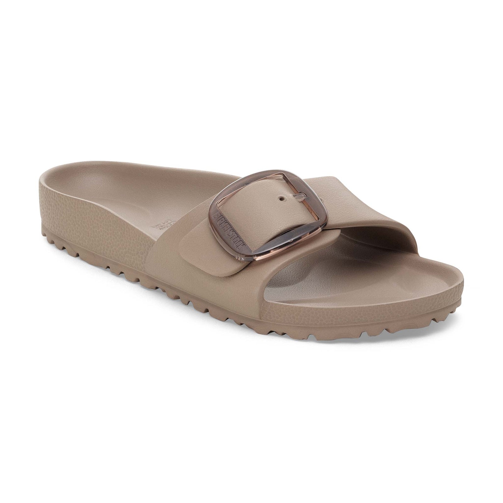 Angled side view of a single taupe Birkenstock sandal with dark buckle on a white background.