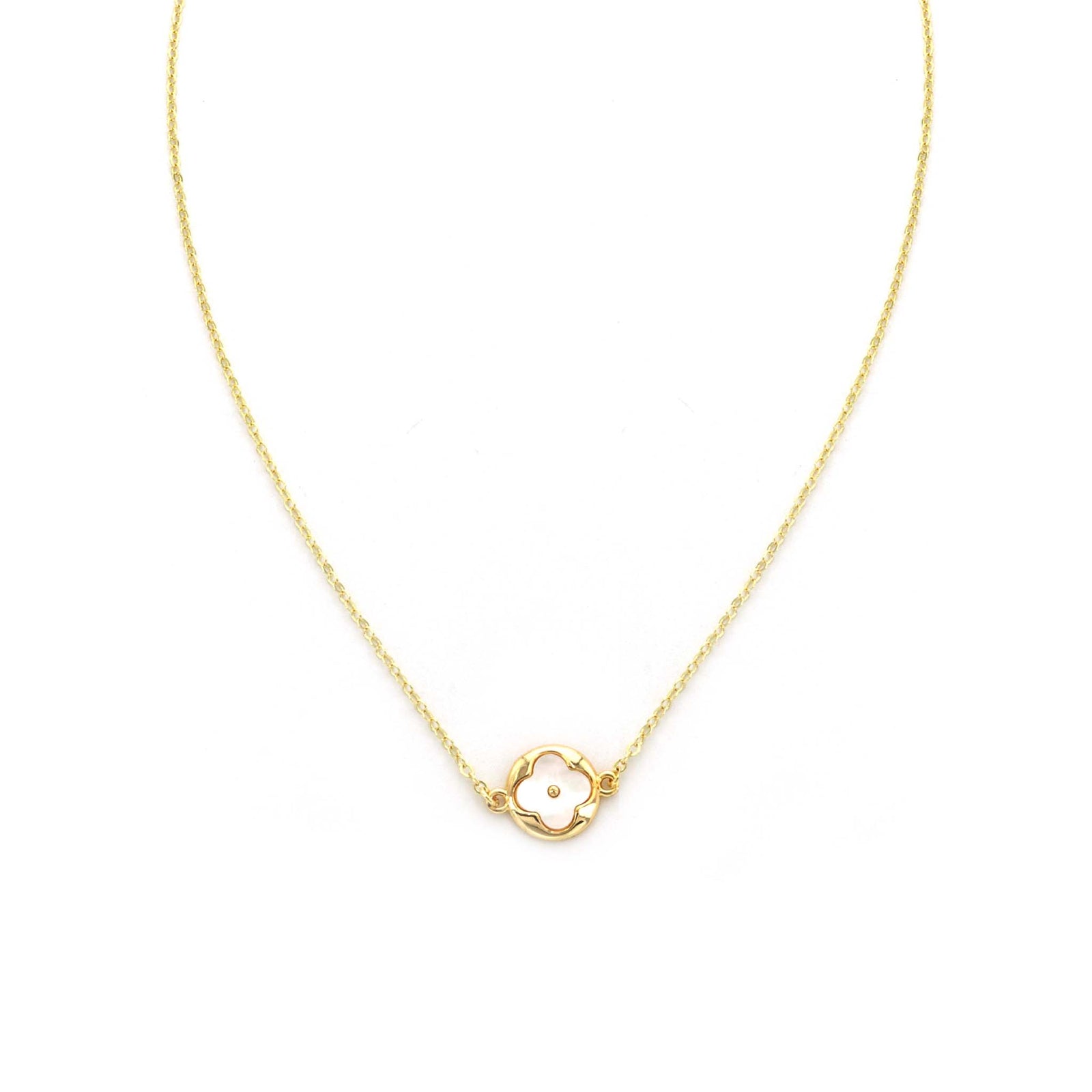Delicate gold chain necklace featuring a centered clover-shaped pendant with a mother of pearl inlay, displayed flat on a white background. By Pannee Group.