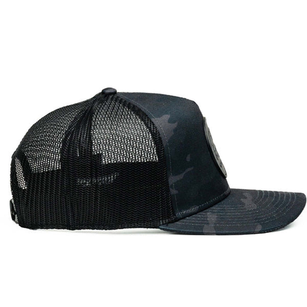 Side view - Stay classic, stay bold. The Pioneer trucker hat by Nuthin Fancy Company features a sharp black camo print with a structured front, mesh back, and adjustable snapback for a custom fit. Finished with the signature Pioneer patch, it’s the perfect mix of everyday comfort and no-nonsense style.
Black camouflage design
Black and gray circle logo patch
Slight pre-curved bill
Plastic snap adjustable snapback
One size fits most