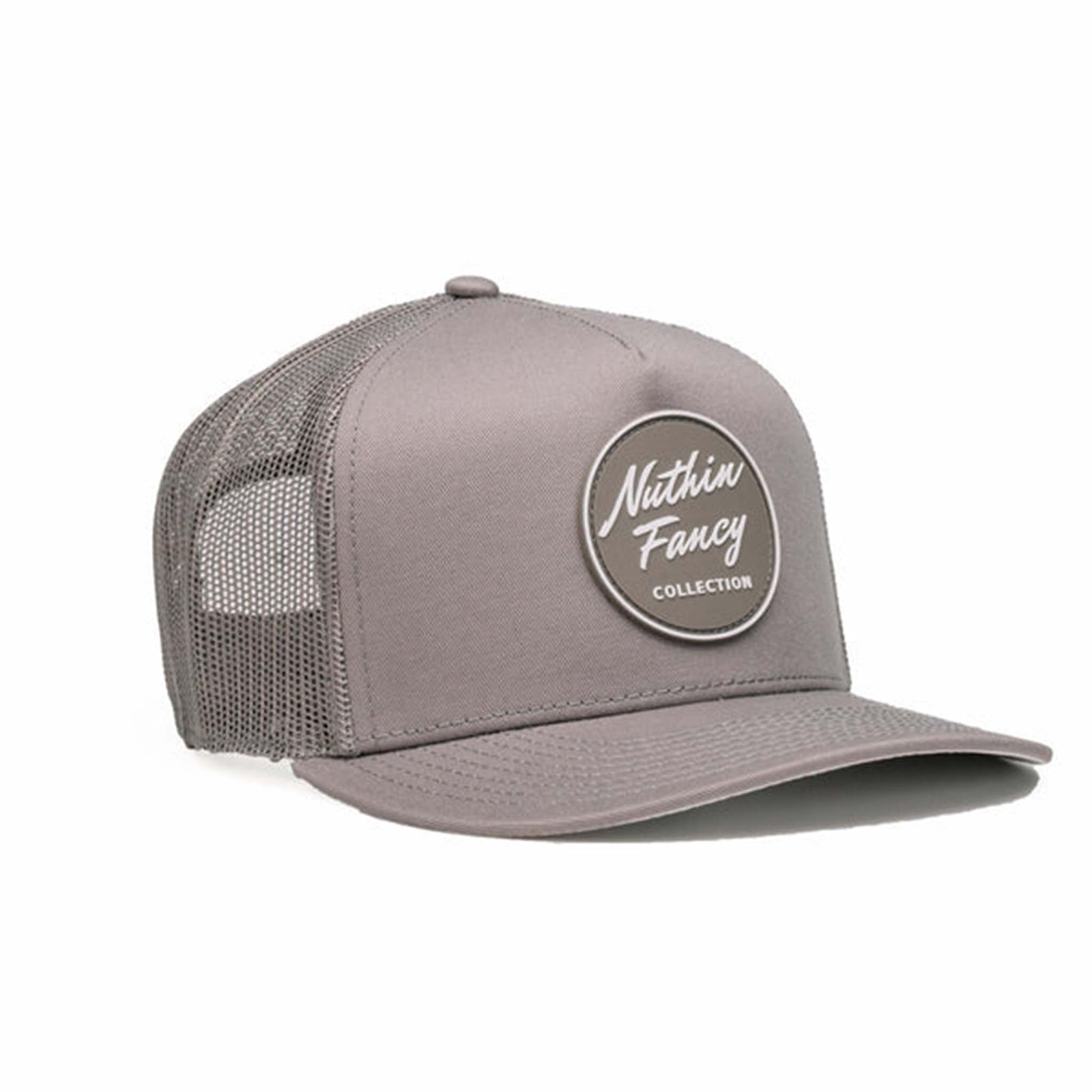 Casual trucker hat with a curved brim, mesh back panels, and an adjustable snapback closure. Features a 'Nuthin’ Fancy Pioneer' logo patch on the front panel.