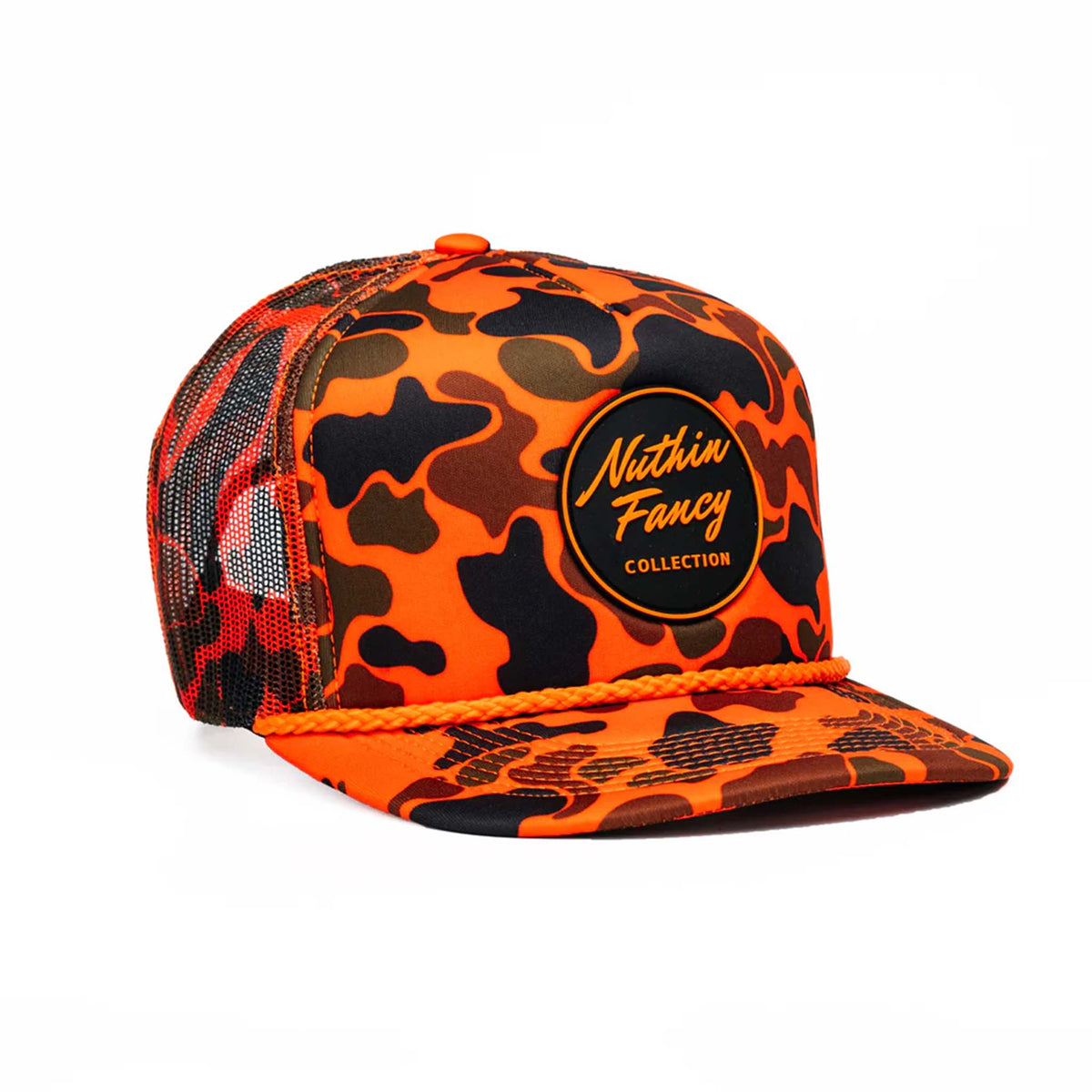 Angled view of orange camo trucker hat highlighting patch logo and flat bill.