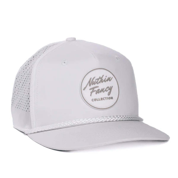 Black performance trucker hat made from moisture-wicking fabric, featuring laser perforated side and back panels for breathability. Includes a white-accented rubber 'Nuthin’ Fancy' patch on the front, a stylish black rope detail above the pre-curved bill, and an adjustable plastic snapback closure. One size fits most (58 cm).