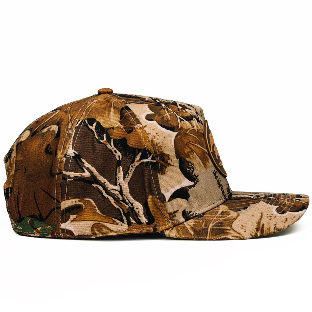 Side profile of brown camo cap showing structured fit and curved bill.