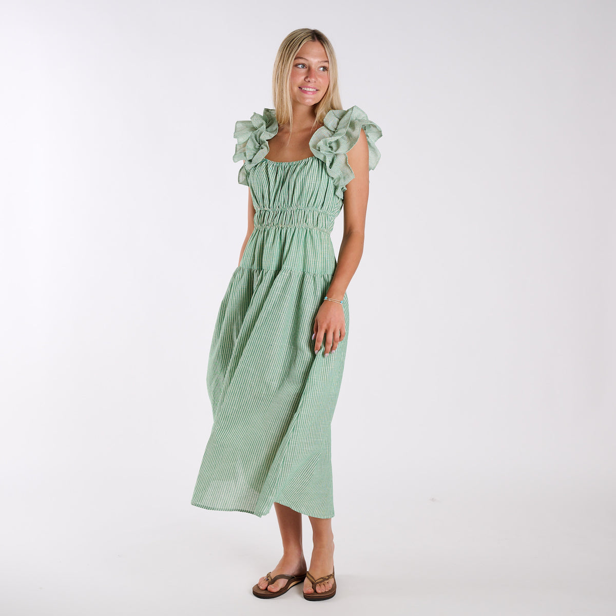 Green | Green stripe seersucker ruffle strap midi dress with tiered skirt and flowy fit, shown in full front view.