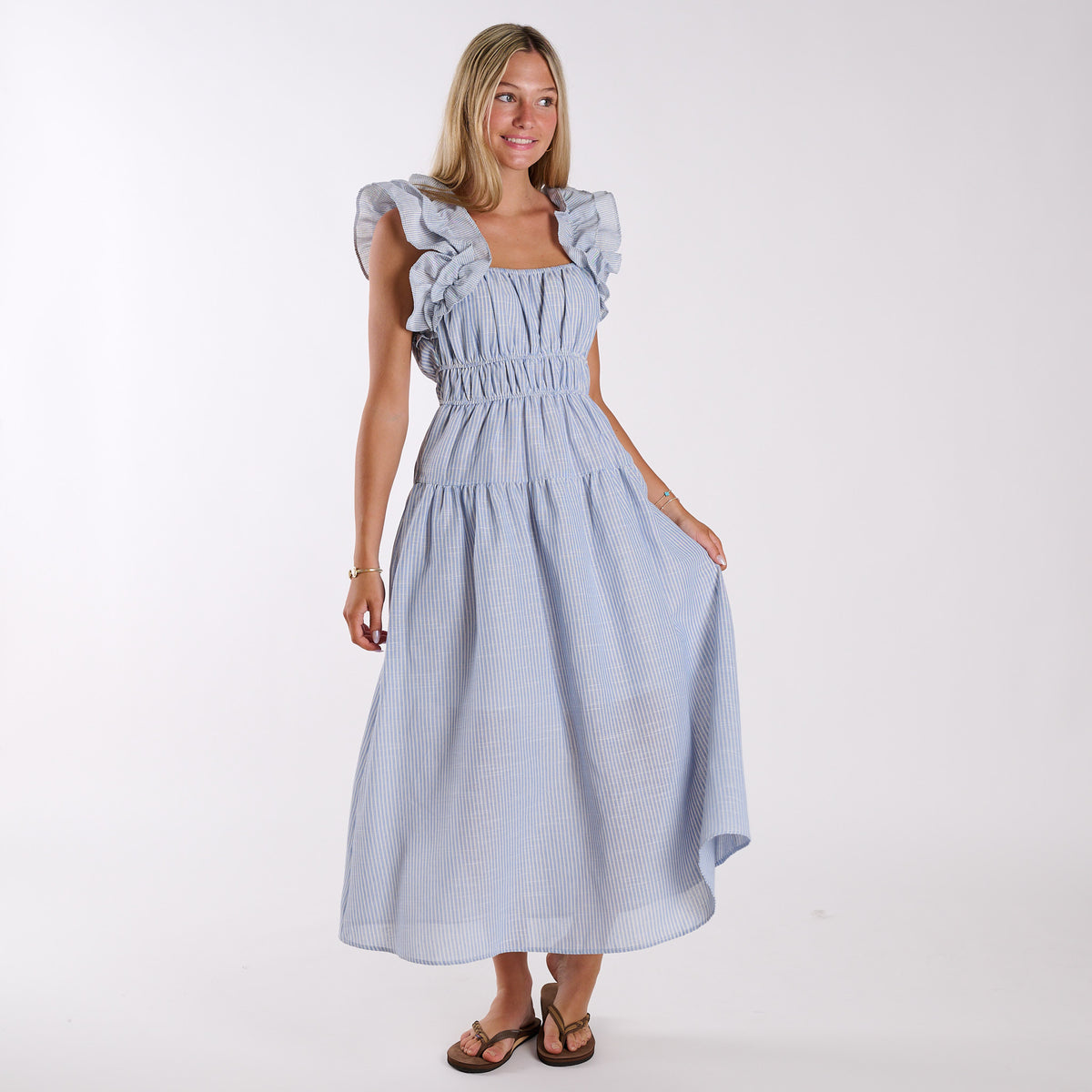 Sky| Blue stripe seersucker ruffle strap maxi dress with tiered skirt and flowy silhouette, shown in full front view.