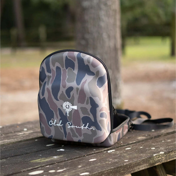 Open view - Old South 6 Hat Travel Case in color Thicket Camo.  
Our Old South - 6 Hat Travel Case is perfect for when you're on the go or in need of storage for your caps. The all-over light weight foam protects your caps from damage and the elements. An out of the way luggage and shoulder strap will fit ensure your hats are not far away!