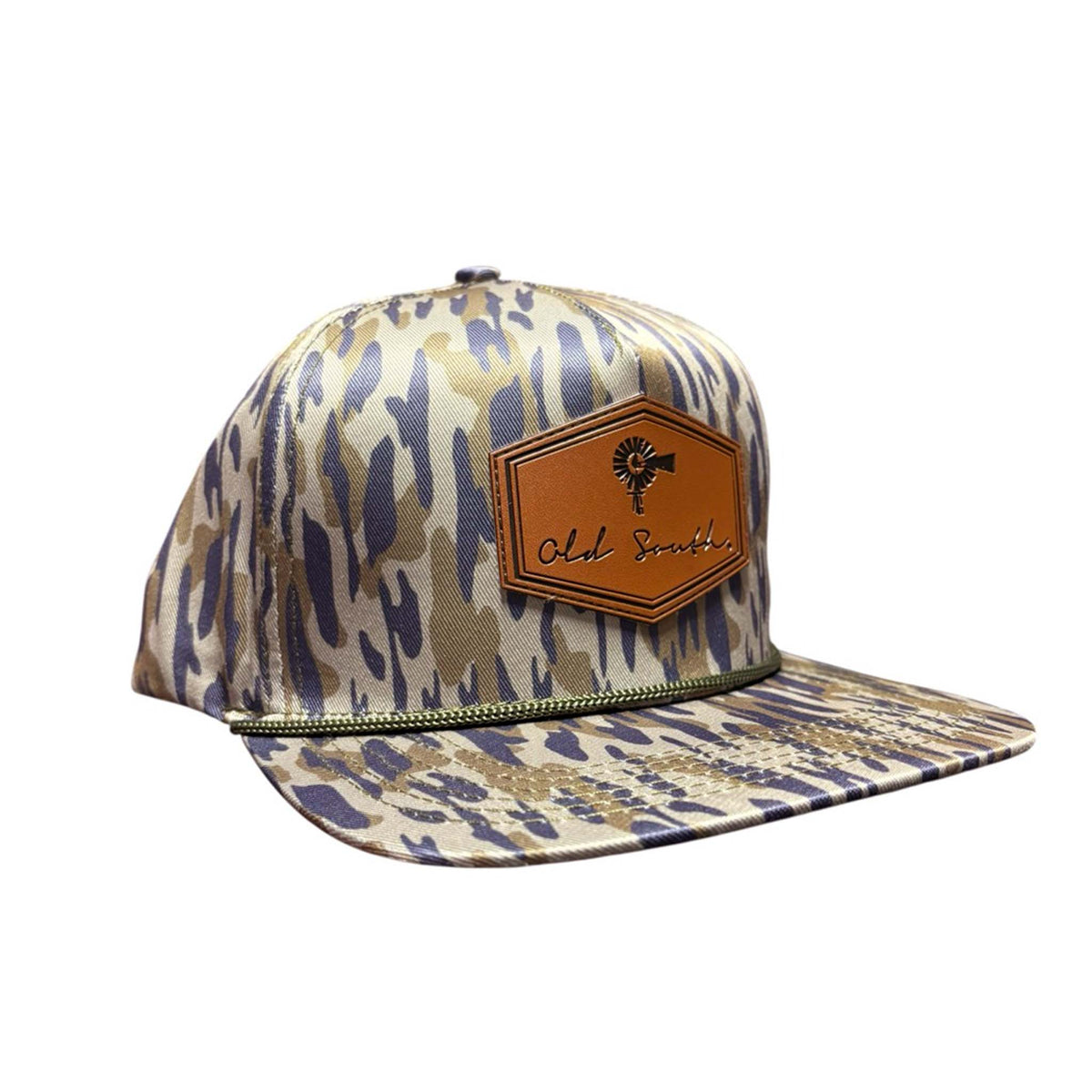 Old South camo print hat with brown leather hexagon patch featuring windmill graphic and “Old South” script, shown at an angle on a white background.