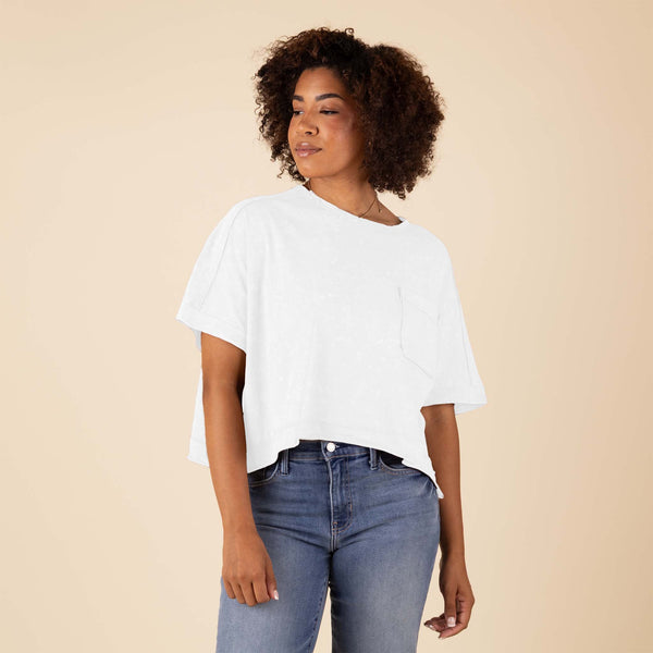  Very J Boxy Top in white on a woman posing in front of a neutral background.