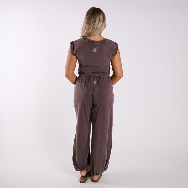Chocolate brown lounge set shown from the back, featuring cap sleeve top and relaxed wide leg pants with elastic waistband.