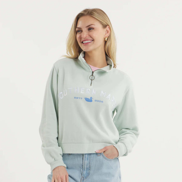 Woman wearing SEAWASH™ Vintage 1/4 zip crewneck in soft cotton with ribbed accents, front YKK ring-pull zipper, and embroidered Southern Marsh logo on chest.