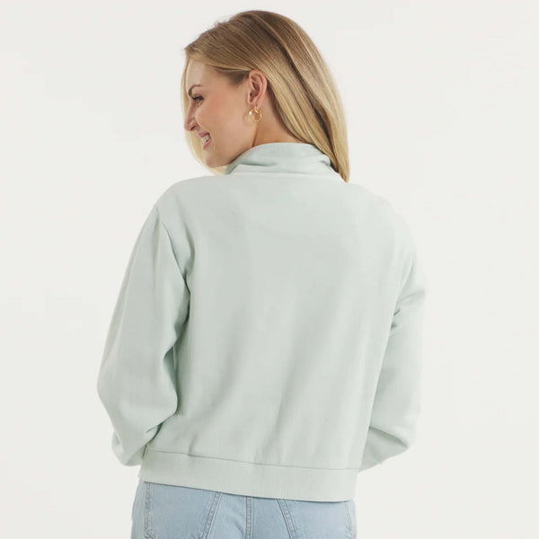 Woman wearing SEAWASH™ Vintage 1/4 zip crewneck in soft cotton with ribbed accents, front YKK ring-pull zipper, and embroidered Southern Marsh logo on chest.