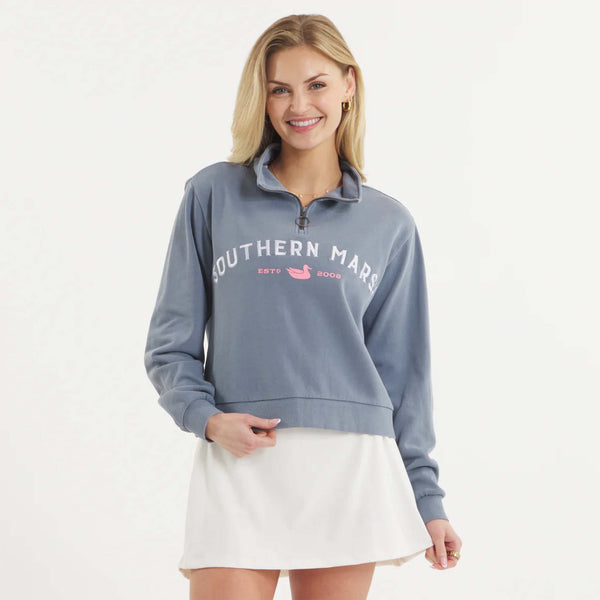 Woman wearing SEAWASH™ Vintage 1/4 zip crewneck in soft cotton with ribbed accents, front YKK ring-pull zipper, and embroidered Southern Marsh logo on chest.