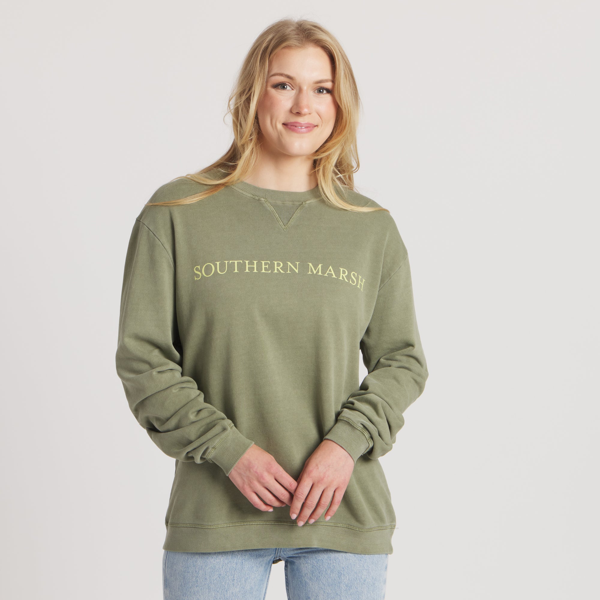 SEAWASH™ Crewneck Sweatshirt in brigade olive. Front view of woman in studio