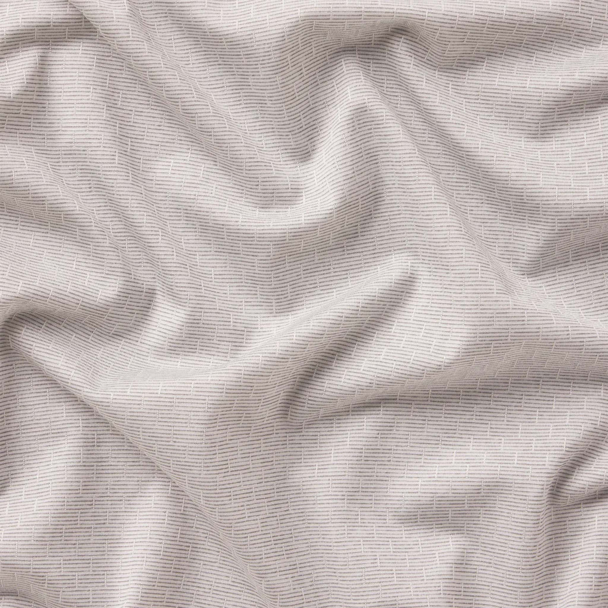 Close-up of textured gray fabric with subtle patterns