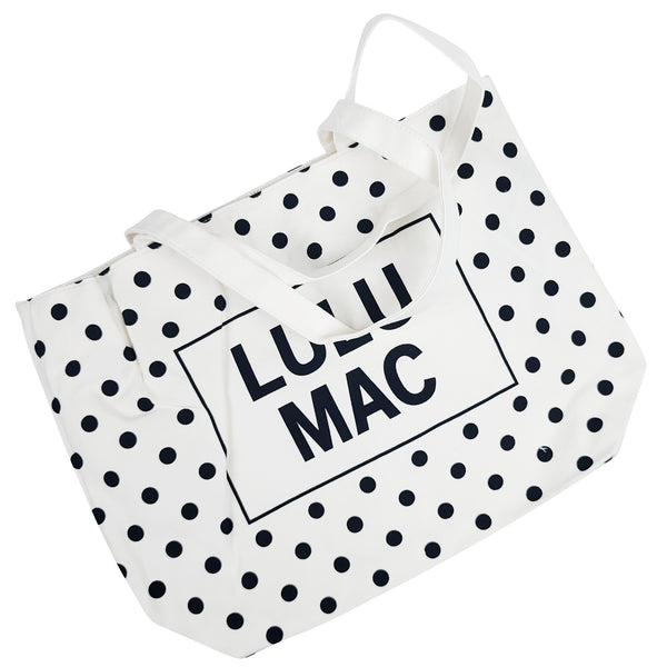  White canvas tote bag with black polka dot pattern and 'LULU MAC' branding on a white background
