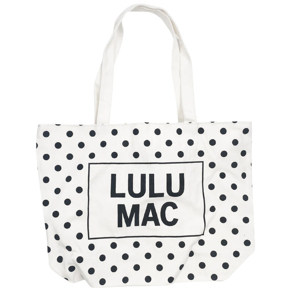  White canvas tote bag with black polka dot pattern and 'LULU MAC' branding on a white background
