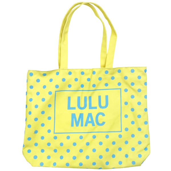 Bright yellow canvas tote bag with turquoise blue polka dot pattern and 'LULU MAC' branding on a white background