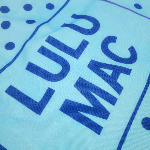  Blue canvas tote bag with navy polka dot pattern and 'LULU MAC' branding on a white background