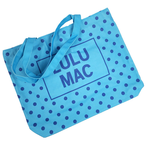  Blue canvas tote bag with navy polka dot pattern and 'LULU MAC' branding on a white background