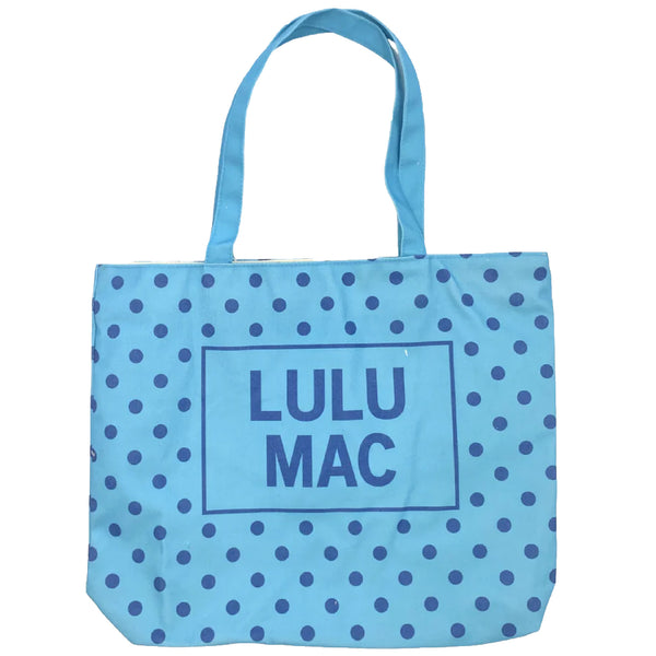  Blue canvas tote bag with navy polka dot pattern and 'LULU MAC' branding on a white background