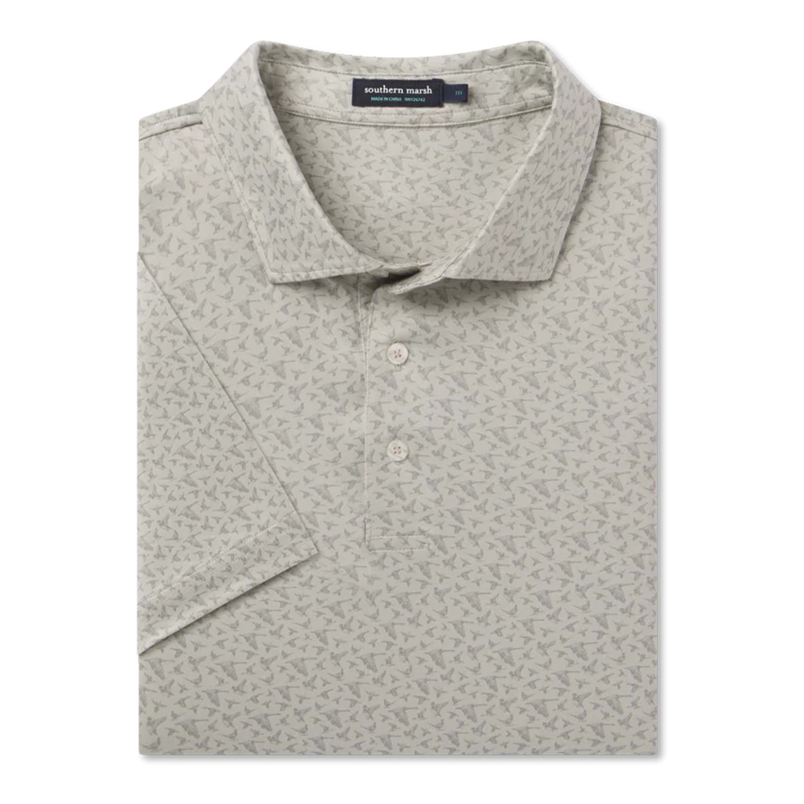 Folded gray patterned polo shirt with a brand label on a white background