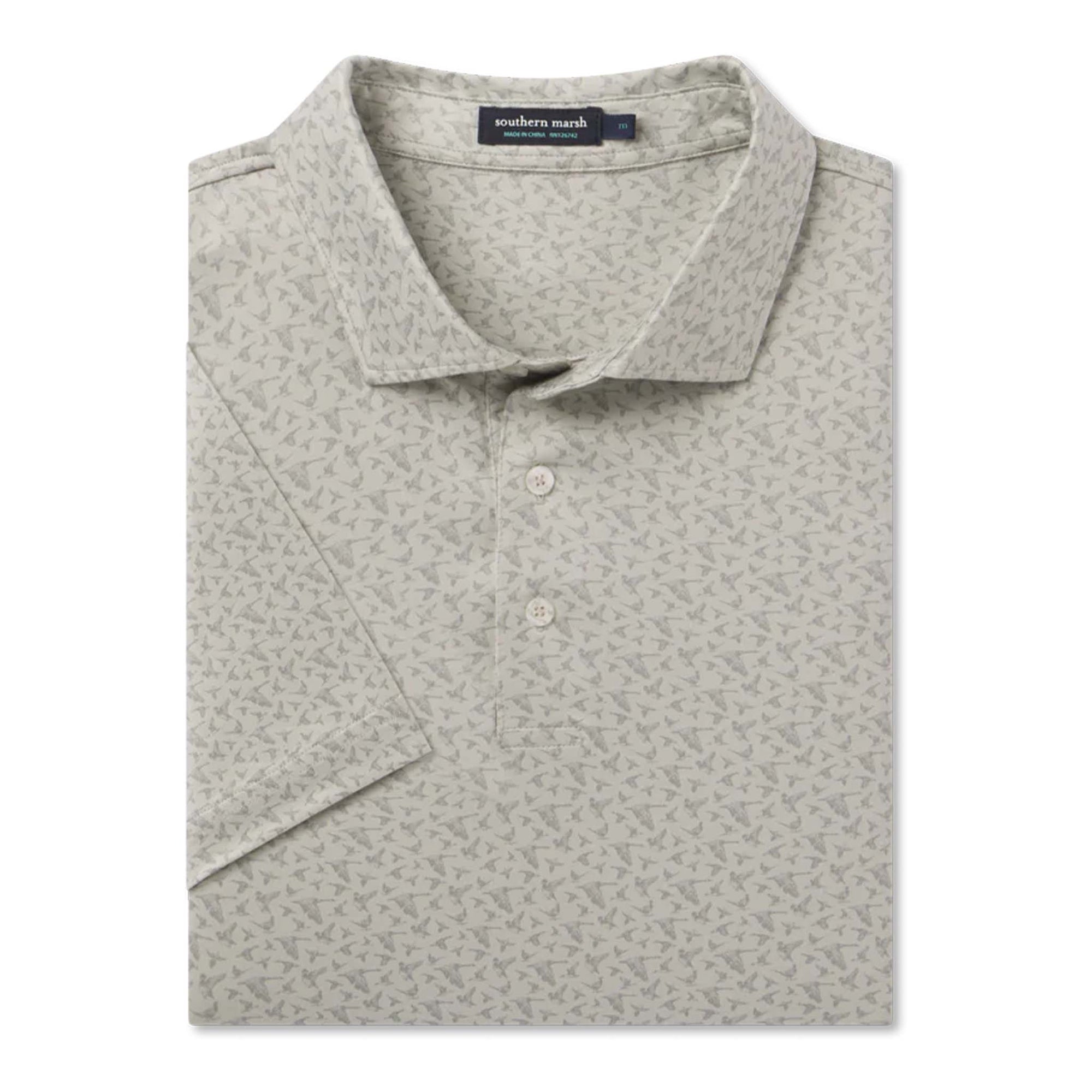 Folded gray patterned polo shirt with a brand label on a white background