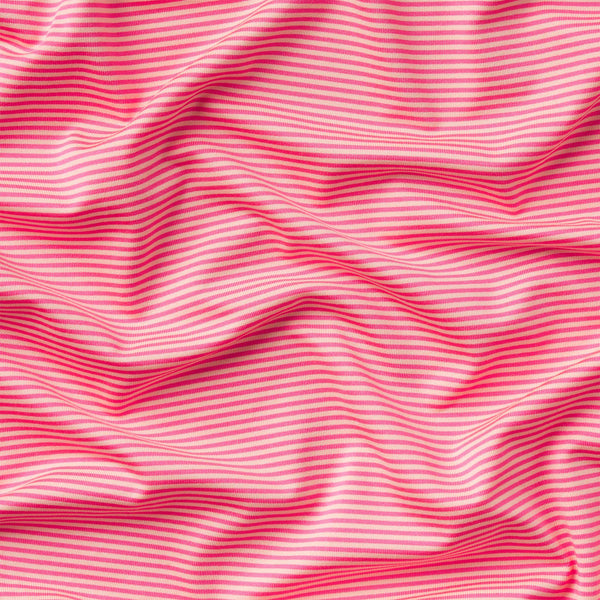 Close up of light peach and strawberry pink horizontal stripes.